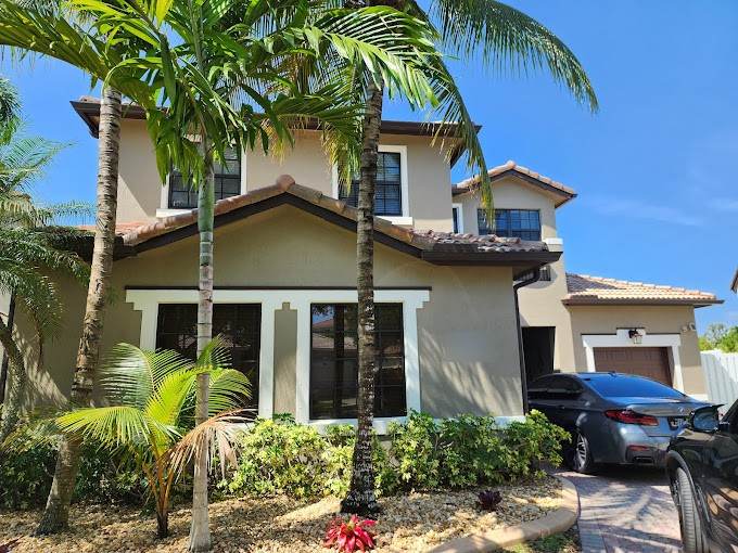 Two-story home with new black-frame impact windows