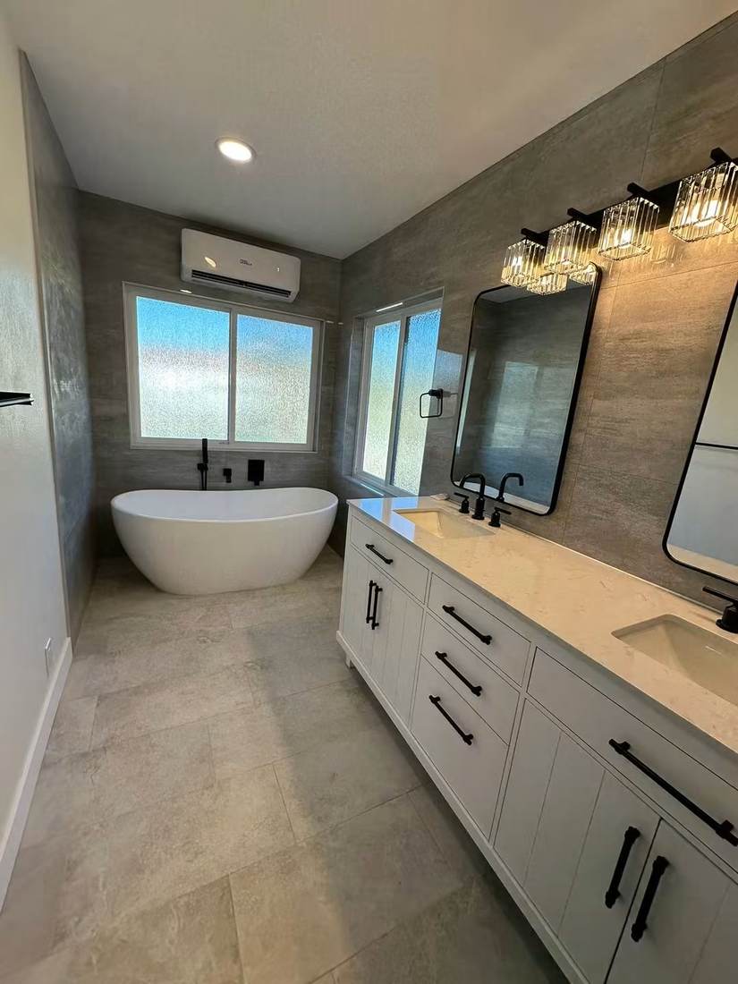 Primary bathroom remodel with freestanding tub, double vanity and large-format tile